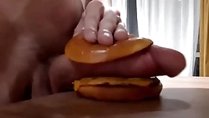 Husky horny teen fucks a burger nearly a big learn of plus cums in it